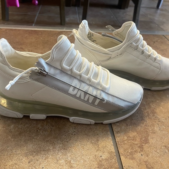 Dkny Shoes - DKNY Women's White Slip-On Sneakers with Silver Logo Accent